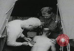 Image of German prisoners carry wounded Saint Mere Eglise France, 1944, second 8 stock footage video 65675080724