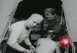 Image of German prisoners carry wounded Saint Mere Eglise France, 1944, second 10 stock footage video 65675080724