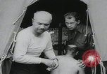 Image of German prisoners carry wounded Saint Mere Eglise France, 1944, second 11 stock footage video 65675080724