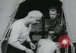 Image of German prisoners carry wounded Saint Mere Eglise France, 1944, second 12 stock footage video 65675080724