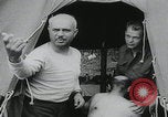 Image of German prisoners carry wounded Saint Mere Eglise France, 1944, second 14 stock footage video 65675080724