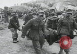 Image of German prisoners carry wounded Saint Mere Eglise France, 1944, second 19 stock footage video 65675080724