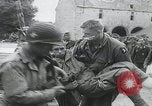 Image of German prisoners carry wounded Saint Mere Eglise France, 1944, second 24 stock footage video 65675080724