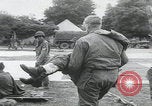 Image of German prisoners carry wounded Saint Mere Eglise France, 1944, second 26 stock footage video 65675080724