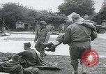 Image of German prisoners carry wounded Saint Mere Eglise France, 1944, second 27 stock footage video 65675080724