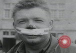 Image of German prisoners carry wounded Saint Mere Eglise France, 1944, second 28 stock footage video 65675080724