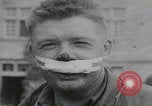 Image of German prisoners carry wounded Saint Mere Eglise France, 1944, second 29 stock footage video 65675080724