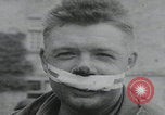 Image of German prisoners carry wounded Saint Mere Eglise France, 1944, second 31 stock footage video 65675080724