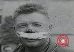 Image of German prisoners carry wounded Saint Mere Eglise France, 1944, second 32 stock footage video 65675080724