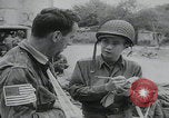 Image of German prisoners carry wounded Saint Mere Eglise France, 1944, second 33 stock footage video 65675080724