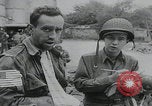 Image of German prisoners carry wounded Saint Mere Eglise France, 1944, second 34 stock footage video 65675080724