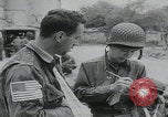Image of German prisoners carry wounded Saint Mere Eglise France, 1944, second 35 stock footage video 65675080724