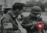 Image of German prisoners carry wounded Saint Mere Eglise France, 1944, second 37 stock footage video 65675080724