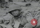 Image of German prisoners carry wounded Saint Mere Eglise France, 1944, second 39 stock footage video 65675080724