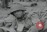 Image of German prisoners carry wounded Saint Mere Eglise France, 1944, second 42 stock footage video 65675080724