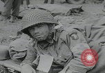 Image of German prisoners carry wounded Saint Mere Eglise France, 1944, second 43 stock footage video 65675080724