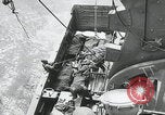 Image of German prisoners carry wounded Saint Mere Eglise France, 1944, second 48 stock footage video 65675080724