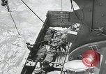 Image of German prisoners carry wounded Saint Mere Eglise France, 1944, second 49 stock footage video 65675080724