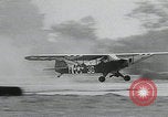 Image of plane landing Normandy France, 1944, second 14 stock footage video 65675080730