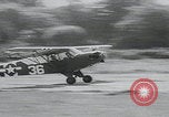 Image of plane landing Normandy France, 1944, second 16 stock footage video 65675080730