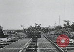 Image of pontoon bridge crossing France, 1944, second 15 stock footage video 65675080731