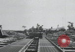 Image of pontoon bridge crossing France, 1944, second 16 stock footage video 65675080731