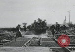 Image of pontoon bridge crossing France, 1944, second 20 stock footage video 65675080731
