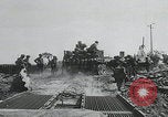 Image of pontoon bridge crossing France, 1944, second 21 stock footage video 65675080731