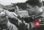 Image of soldier getting haircut United Kingdom, 1944, second 15 stock footage video 65675080737