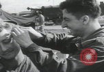 Image of soldier getting haircut United Kingdom, 1944, second 16 stock footage video 65675080737
