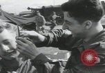 Image of soldier getting haircut United Kingdom, 1944, second 17 stock footage video 65675080737