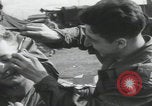 Image of soldier getting haircut United Kingdom, 1944, second 18 stock footage video 65675080737
