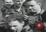 Image of soldier getting haircut United Kingdom, 1944, second 25 stock footage video 65675080737