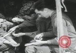 Image of soldier getting haircut United Kingdom, 1944, second 33 stock footage video 65675080737