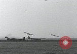 Image of Waco gliders landing Holland Netherlands, 1944, second 48 stock footage video 65675080744