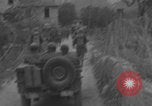 Image of American soldiers walking through Querceta Italy Querceta Italy, 1945, second 3 stock footage video 65675080794