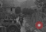 Image of American soldiers walking through Querceta Italy Querceta Italy, 1945, second 5 stock footage video 65675080794