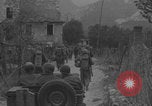 Image of American soldiers walking through Querceta Italy Querceta Italy, 1945, second 7 stock footage video 65675080794