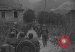Image of American soldiers walking through Querceta Italy Querceta Italy, 1945, second 12 stock footage video 65675080794