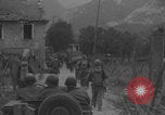 Image of American soldiers walking through Querceta Italy Querceta Italy, 1945, second 14 stock footage video 65675080794