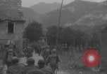 Image of American soldiers walking through Querceta Italy Querceta Italy, 1945, second 16 stock footage video 65675080794