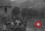 Image of American soldiers walking through Querceta Italy Querceta Italy, 1945, second 17 stock footage video 65675080794
