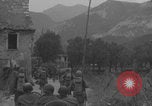 Image of American soldiers walking through Querceta Italy Querceta Italy, 1945, second 18 stock footage video 65675080794