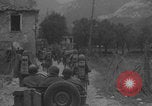 Image of American soldiers walking through Querceta Italy Querceta Italy, 1945, second 19 stock footage video 65675080794