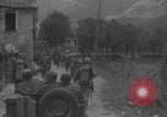 Image of American soldiers walking through Querceta Italy Querceta Italy, 1945, second 20 stock footage video 65675080794