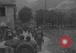 Image of American soldiers walking through Querceta Italy Querceta Italy, 1945, second 21 stock footage video 65675080794