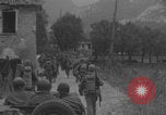 Image of American soldiers walking through Querceta Italy Querceta Italy, 1945, second 23 stock footage video 65675080794