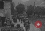 Image of American soldiers walking through Querceta Italy Querceta Italy, 1945, second 25 stock footage video 65675080794