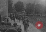 Image of American soldiers walking through Querceta Italy Querceta Italy, 1945, second 27 stock footage video 65675080794