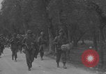 Image of American soldiers walking through Querceta Italy Querceta Italy, 1945, second 28 stock footage video 65675080794